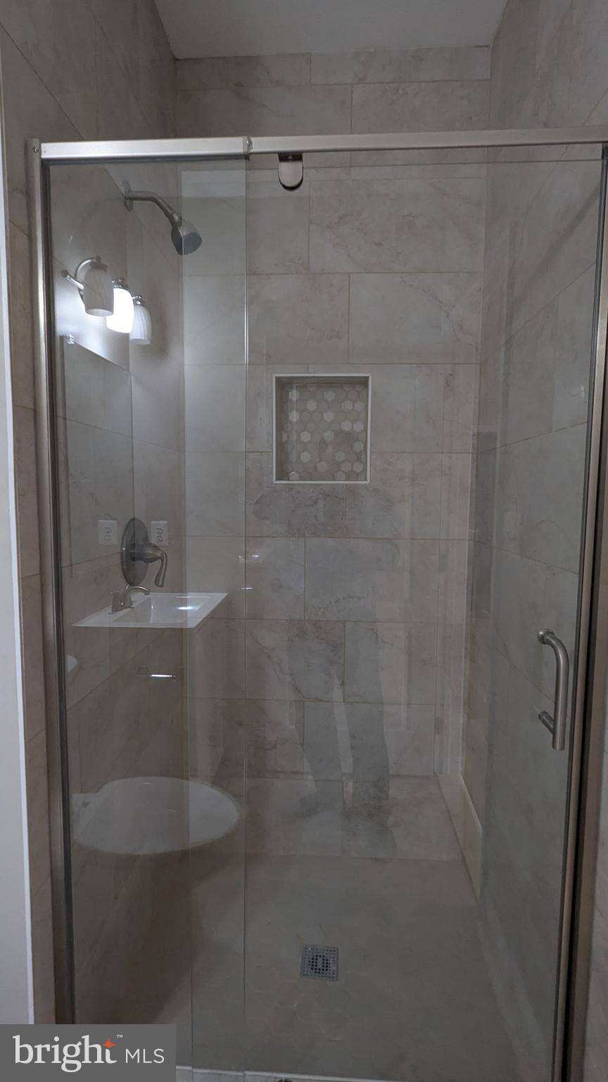 21506 Trowbridge Square Ashburn, VA 20147 - Photo 51 of 66 a bathroom with a shower