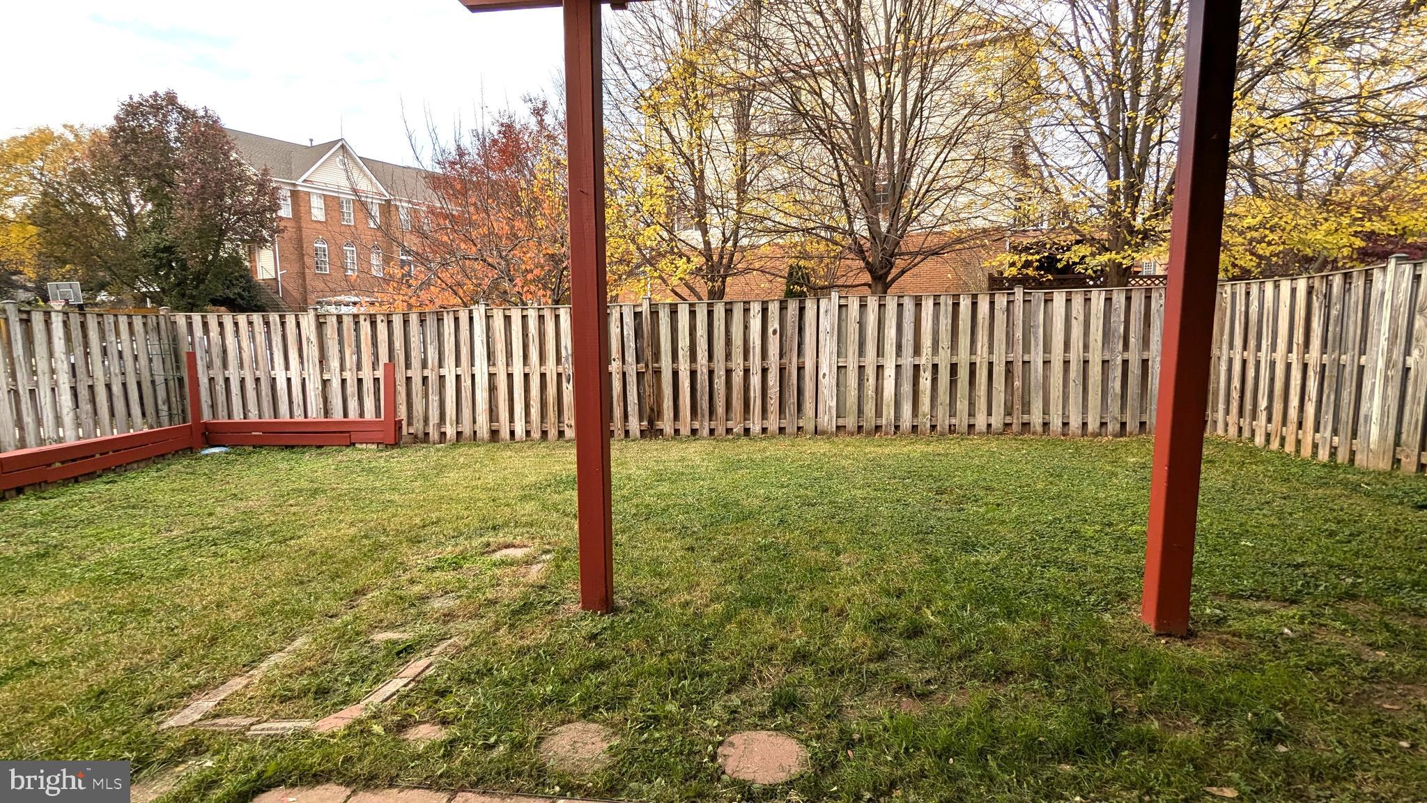 21506 Trowbridge Square Ashburn, VA 20147 - Photo 56 of 66 a view of a yard with a fence
