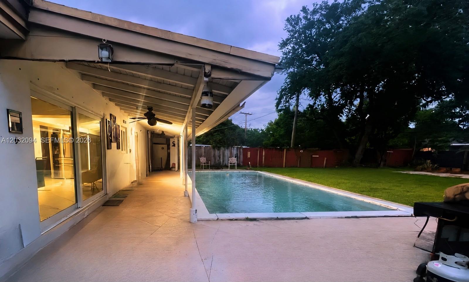 6492 Southwest 25th Street Miramar, FL 33023 - Photo 7 of 9 a view of a backyard with swimming pool