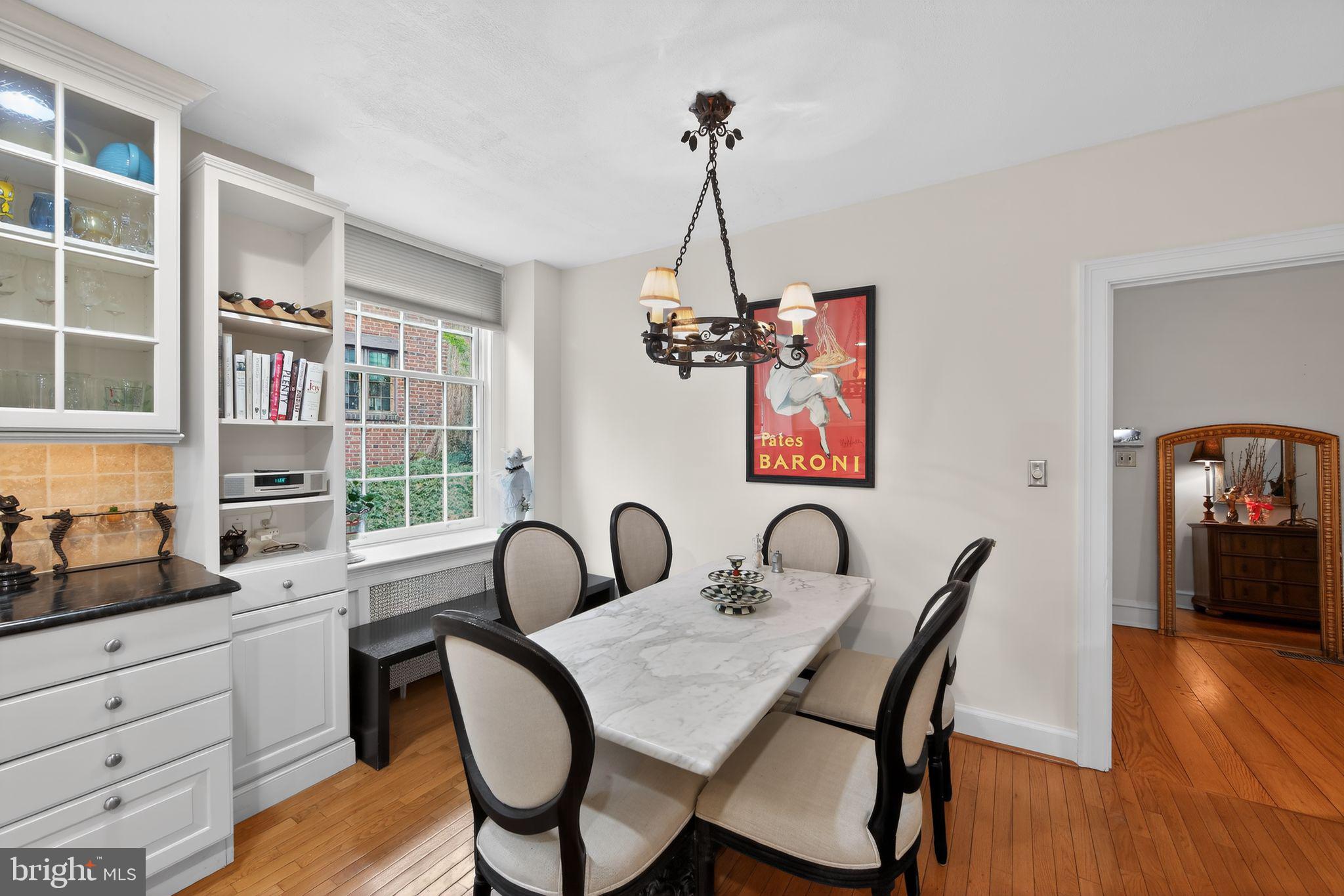 306 Windsor Avenue Wayne, PA 19087 - Photo 11 of 36 a dining room with furniture a chandelier and wooden floor
