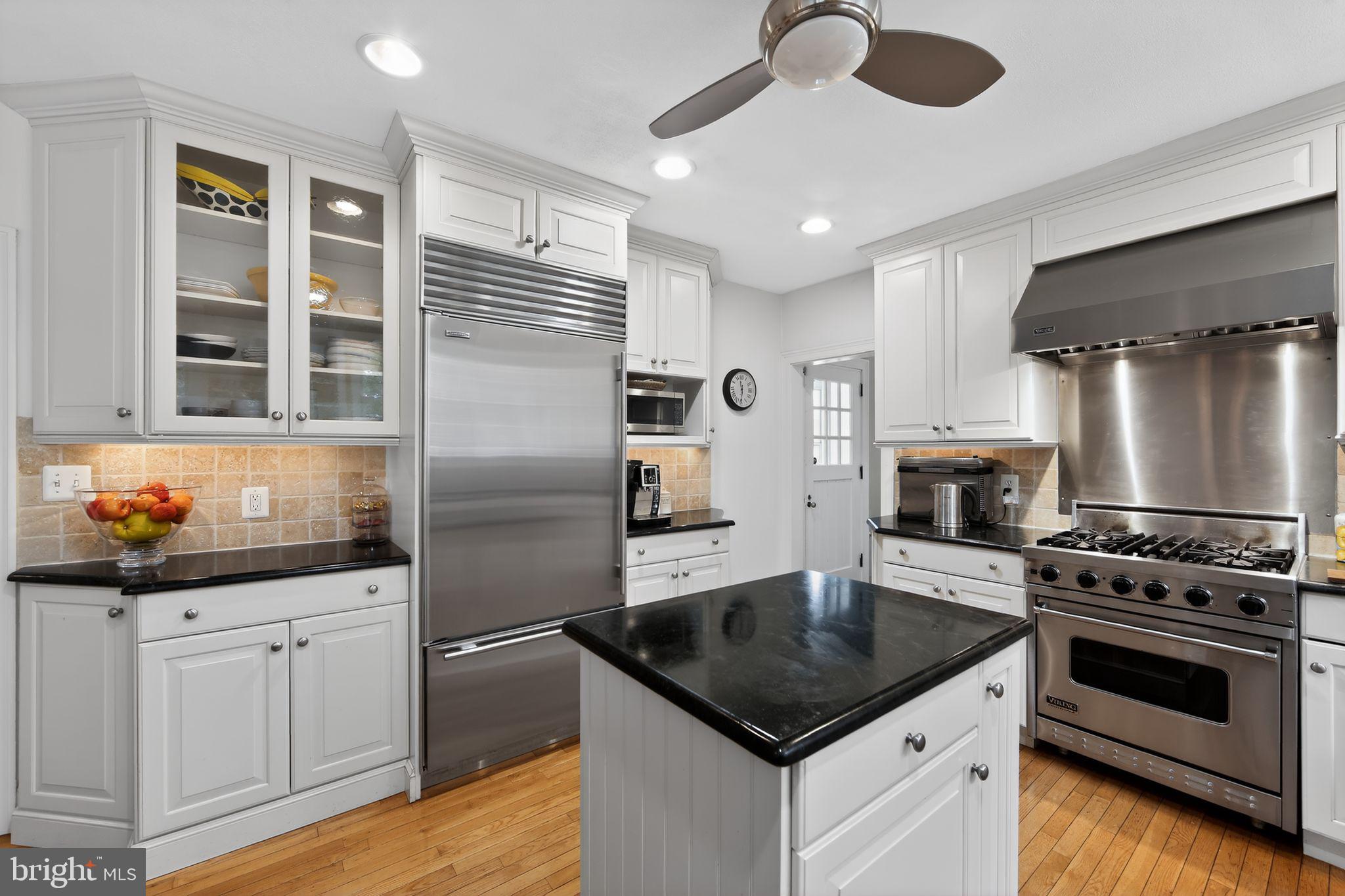 306 Windsor Avenue Wayne, PA 19087 - Photo 13 of 36 a kitchen with granite countertop a stove sink and refrigerator