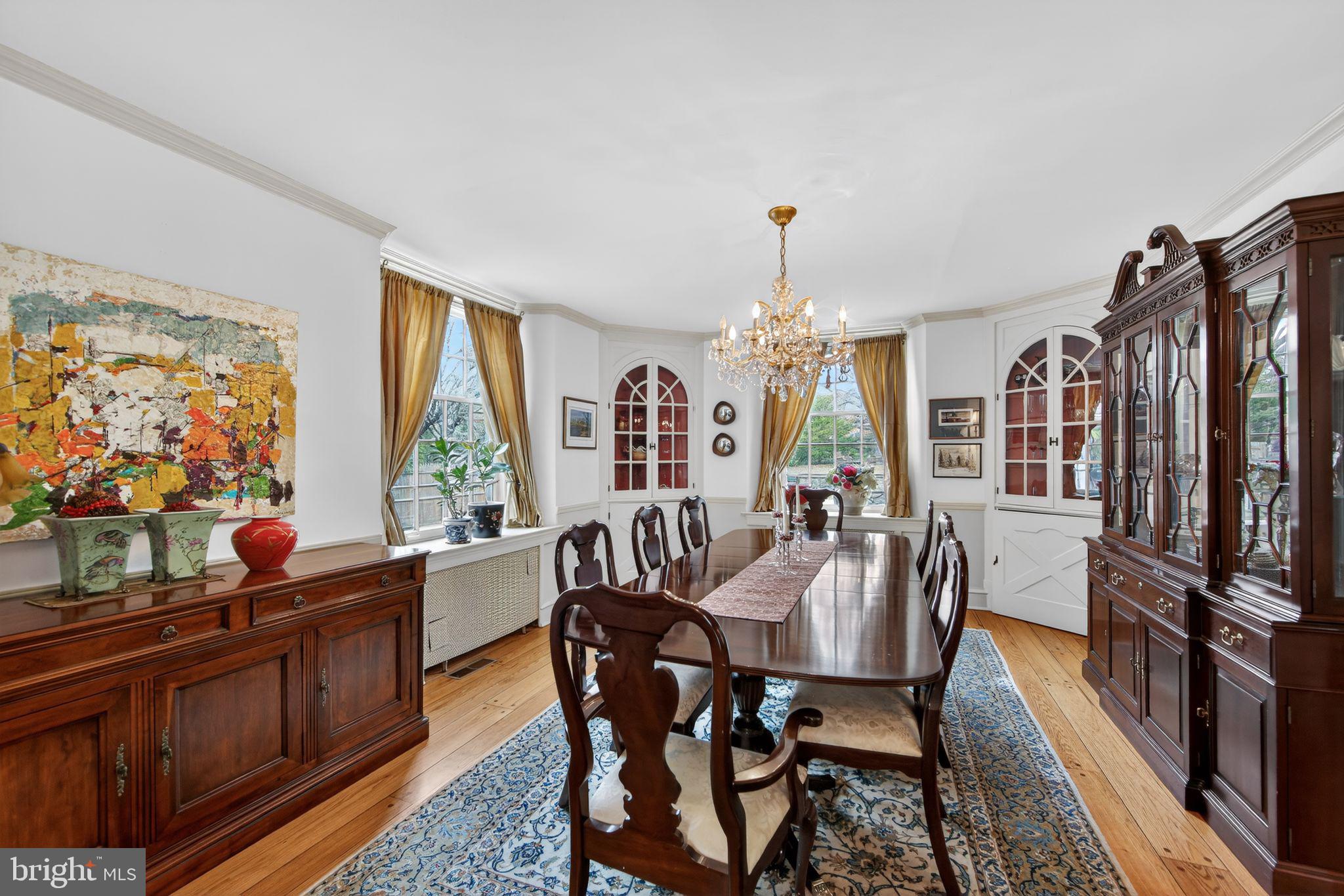 306 Windsor Avenue Wayne, PA 19087 - Photo 16 of 36 a view of a dining room with furniture a chandelier and wooden floor