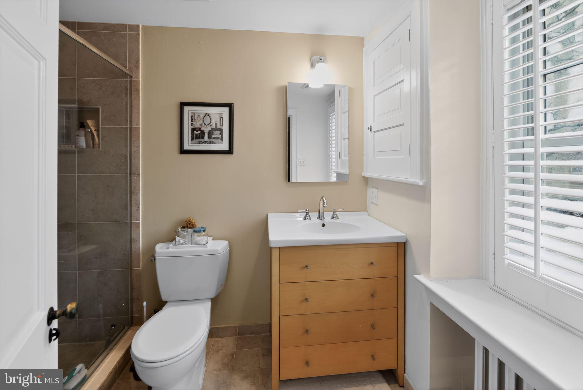 306 Windsor Avenue Wayne, PA 19087 - Photo 26 of 36 a bathroom with a toilet sink vanity granite and mirror