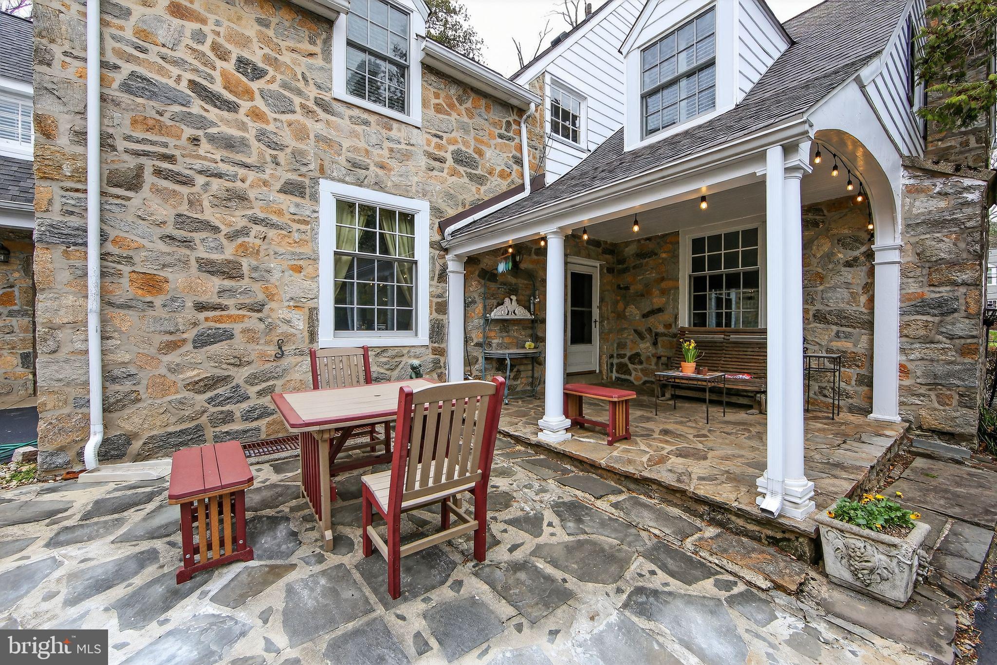 306 Windsor Avenue Wayne, PA 19087 - Photo 4 of 36 a view of a dinning tables and chairs in the patio