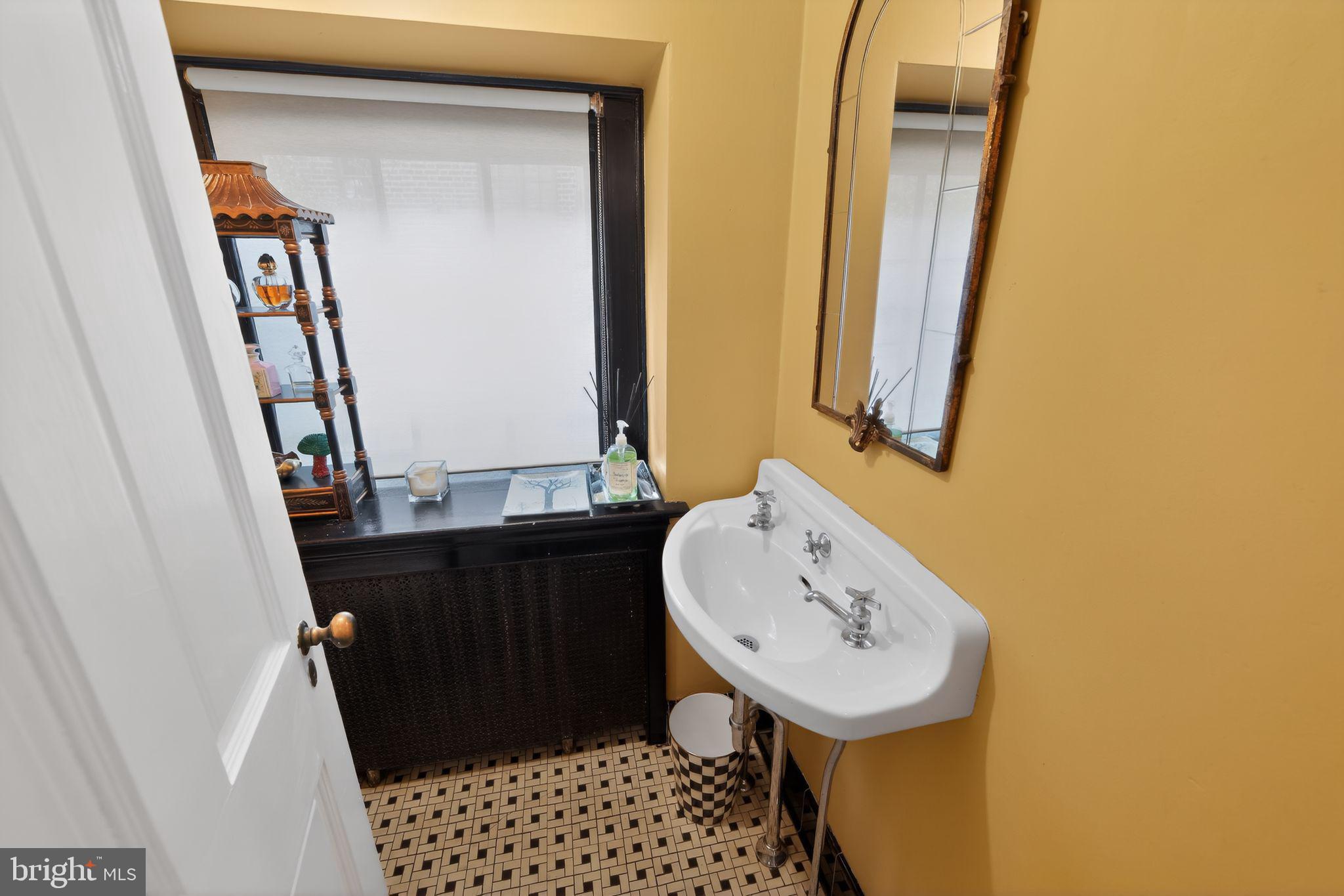 306 Windsor Avenue Wayne, PA 19087 - Photo 9 of 36 a bathroom with a sink a mirror and shower