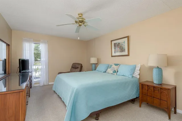 a bedroom with a bed and furniture