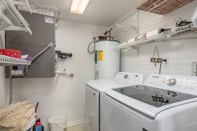 a utility room with dryer and washer