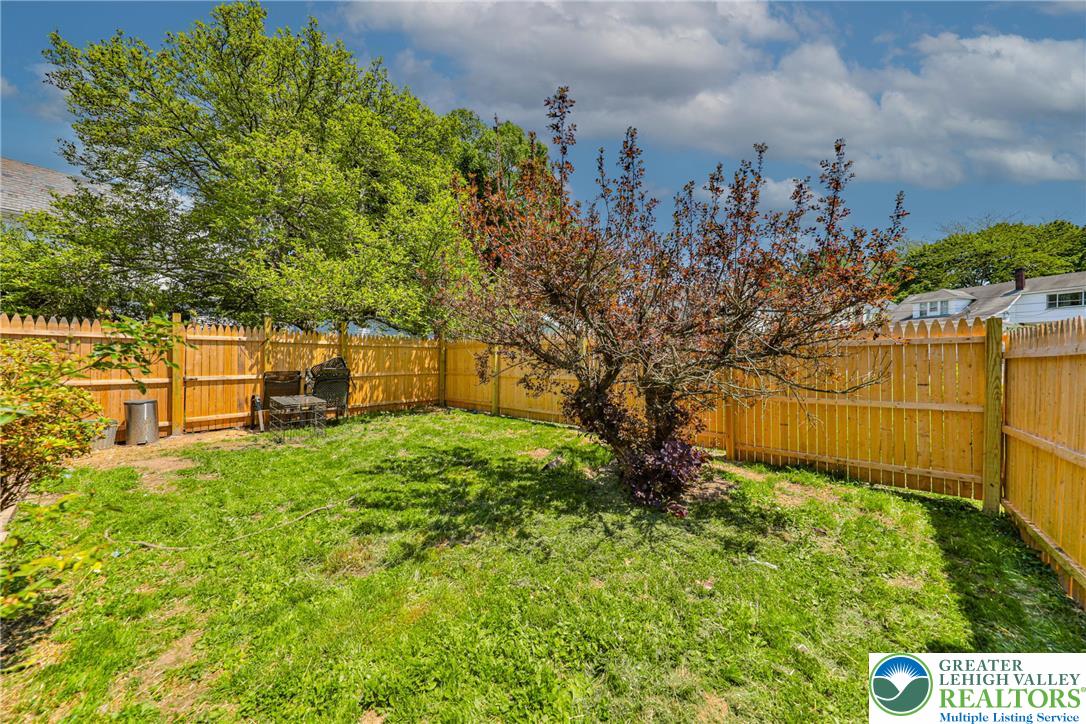 417 3rd Street Lehighton, PA 18235 - Photo 33 of 39 A well-maintained, private outdoor area featuring a manicured lawn and sturdy perimeter fencing.