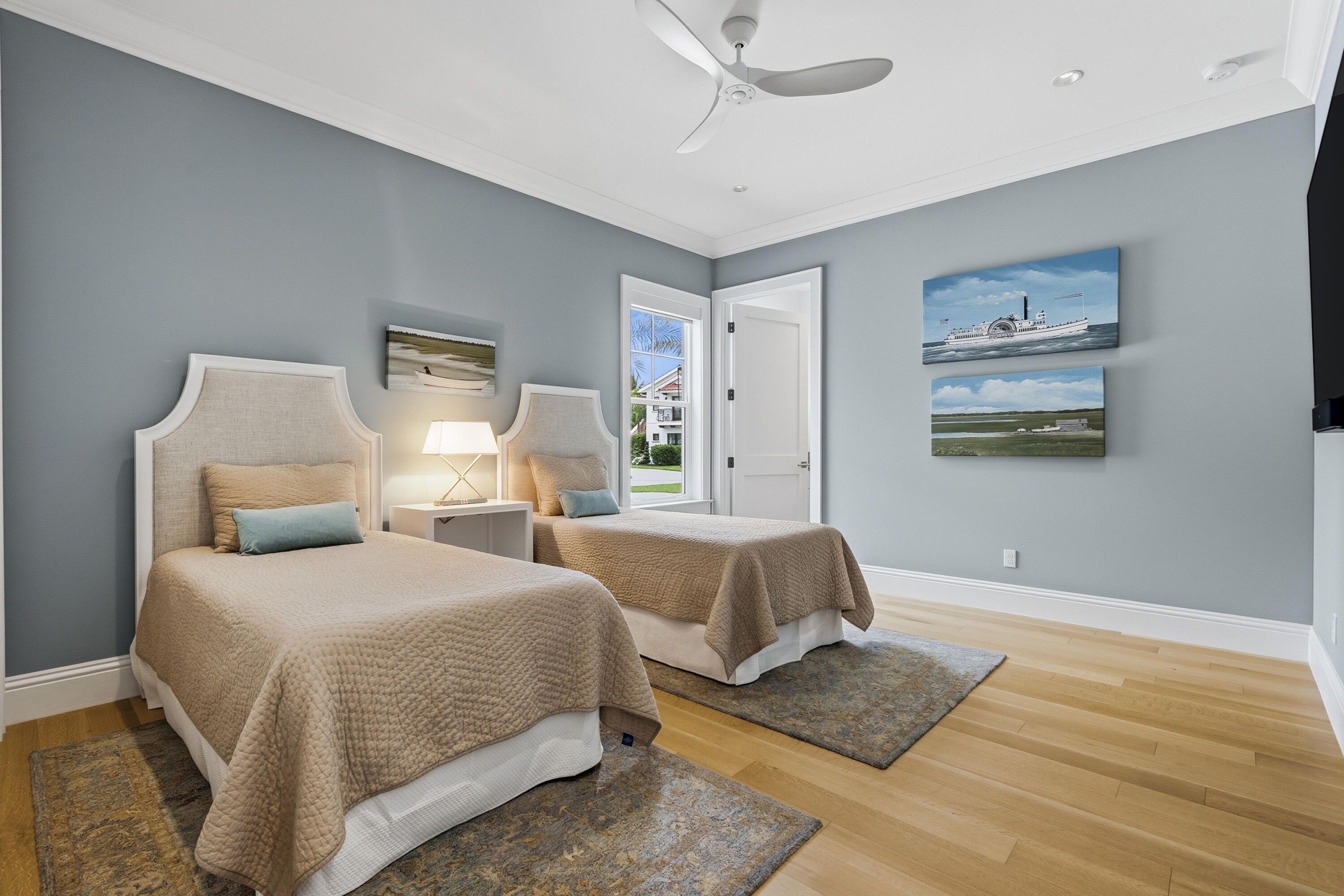 3973 Southeast Topsail Court Stuart, FL 34997 - Photo 20 of 38 a bedroom with two beds and painting on the wall