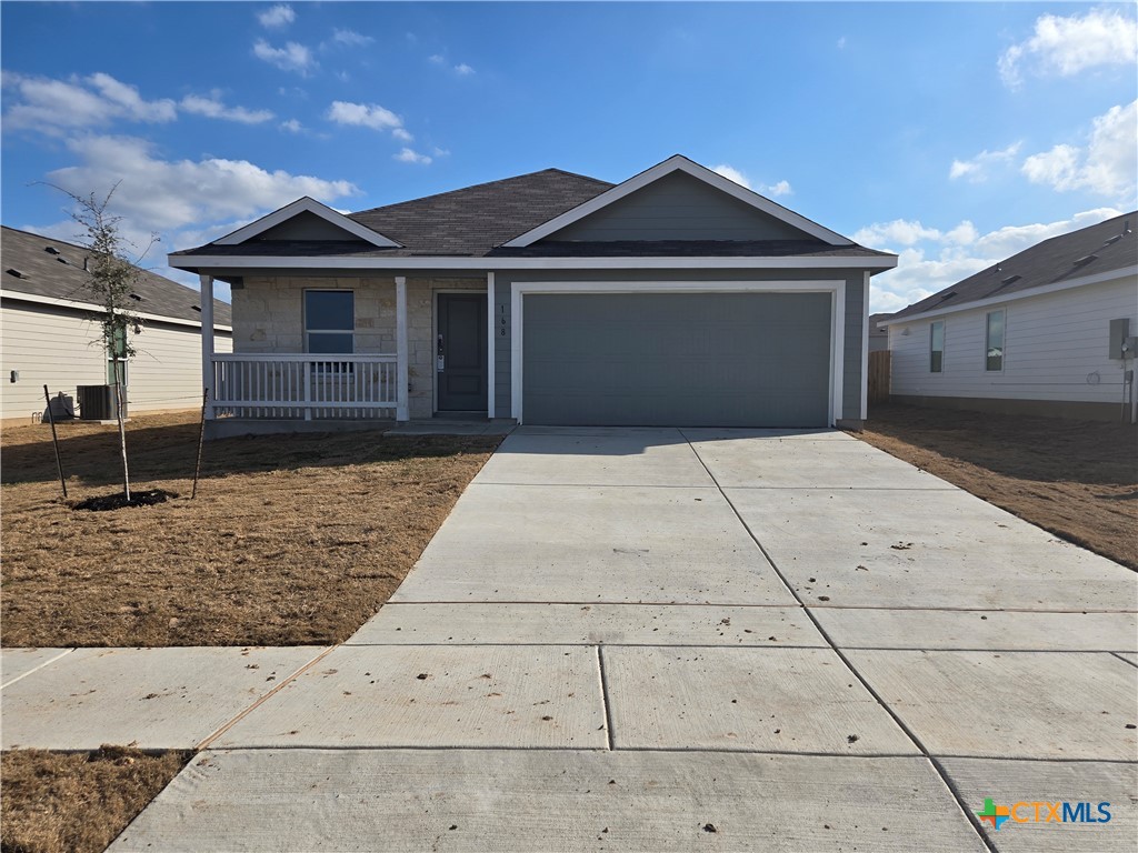168 Wolf Crest Boulevard Seguin, TX 78155 - Photo 1 of 1 a front view of a house with a yard and garage
