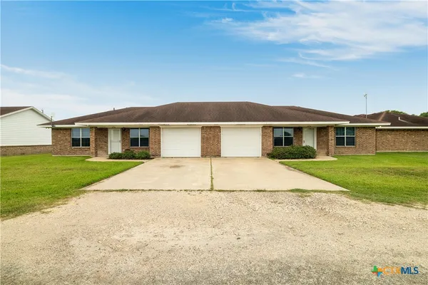front view of a house and a yard