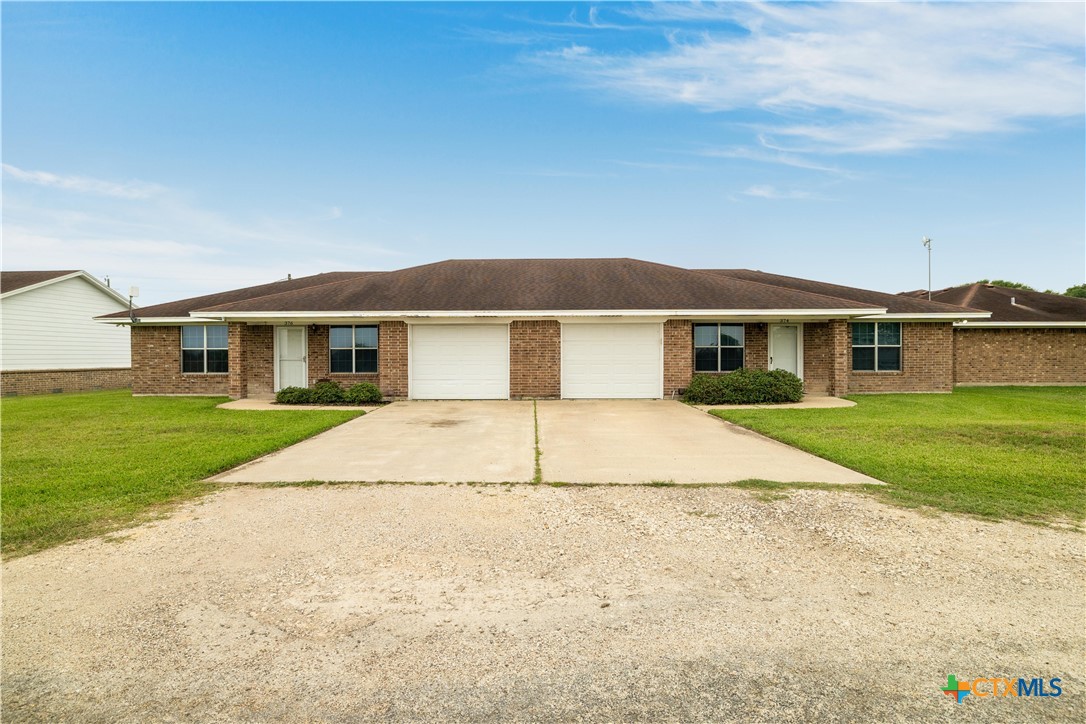 374-376 Navidad Street Vanderbilt, TX 77991 - Photo 1 of 28 front view of a house and a yard