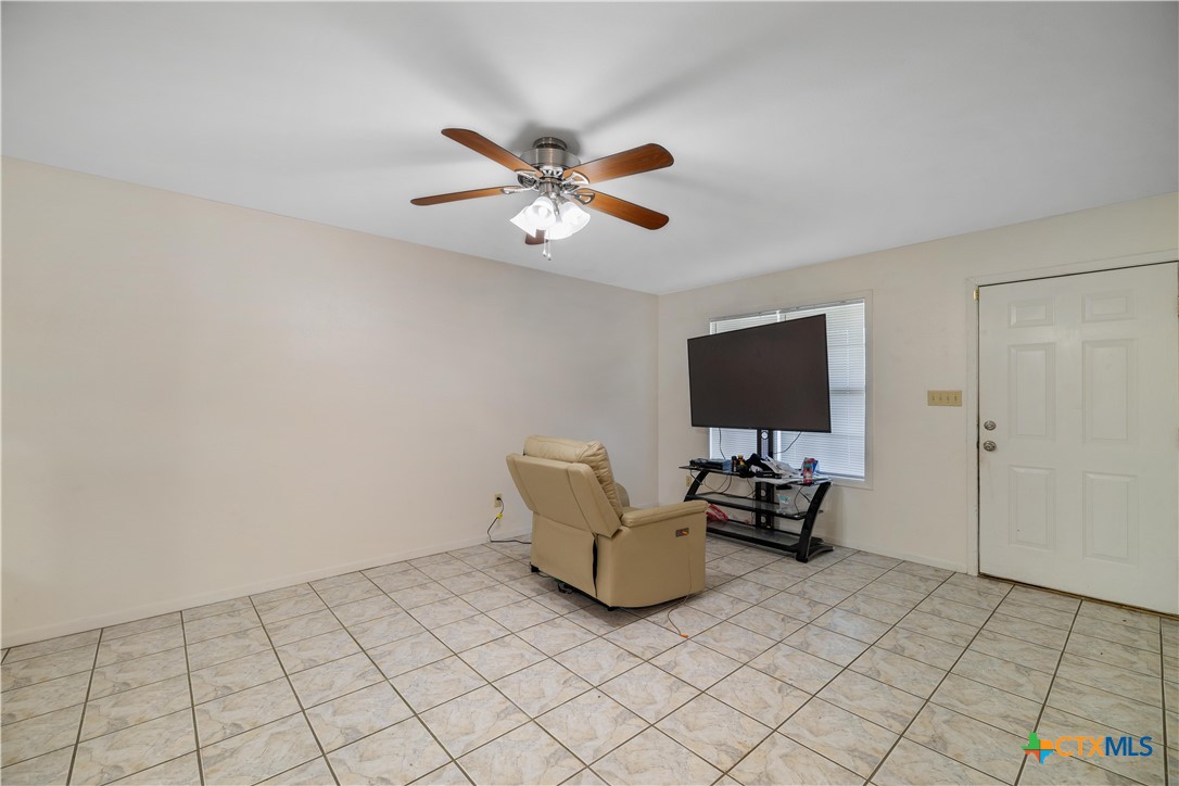 374-376 Navidad Street Vanderbilt, TX 77991 - Photo 14 of 28 a living room with furniture and a flat screen tv