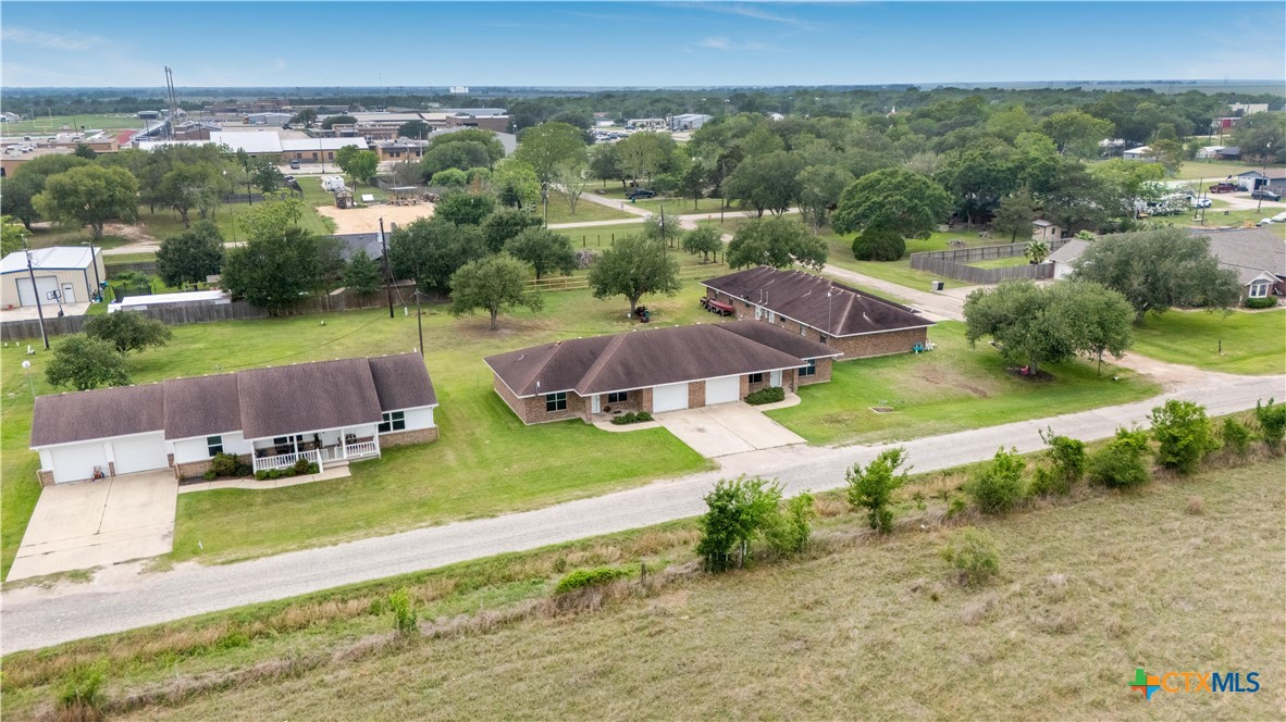 374-376 Navidad Street Vanderbilt, TX 77991 - Photo 23 of 28 an aerial view of a house with garden space and street view