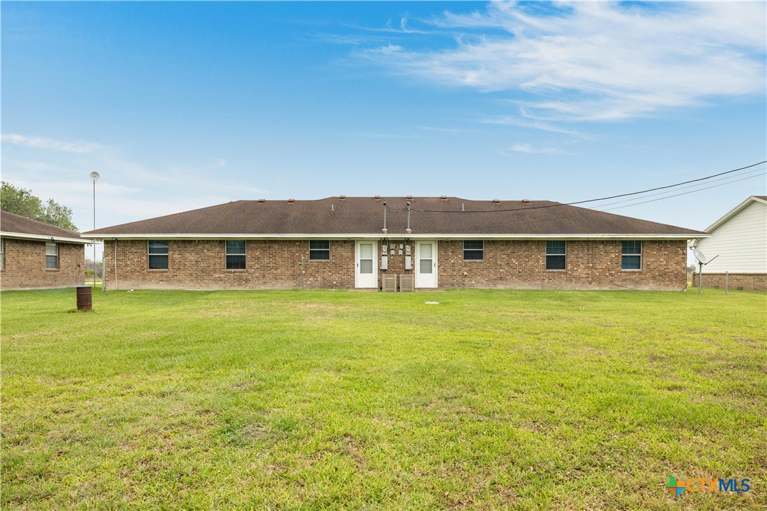 374-376 Navidad Street Vanderbilt, TX 77991 - Photo 27 of 28 a view of a big house with a big yard and large trees