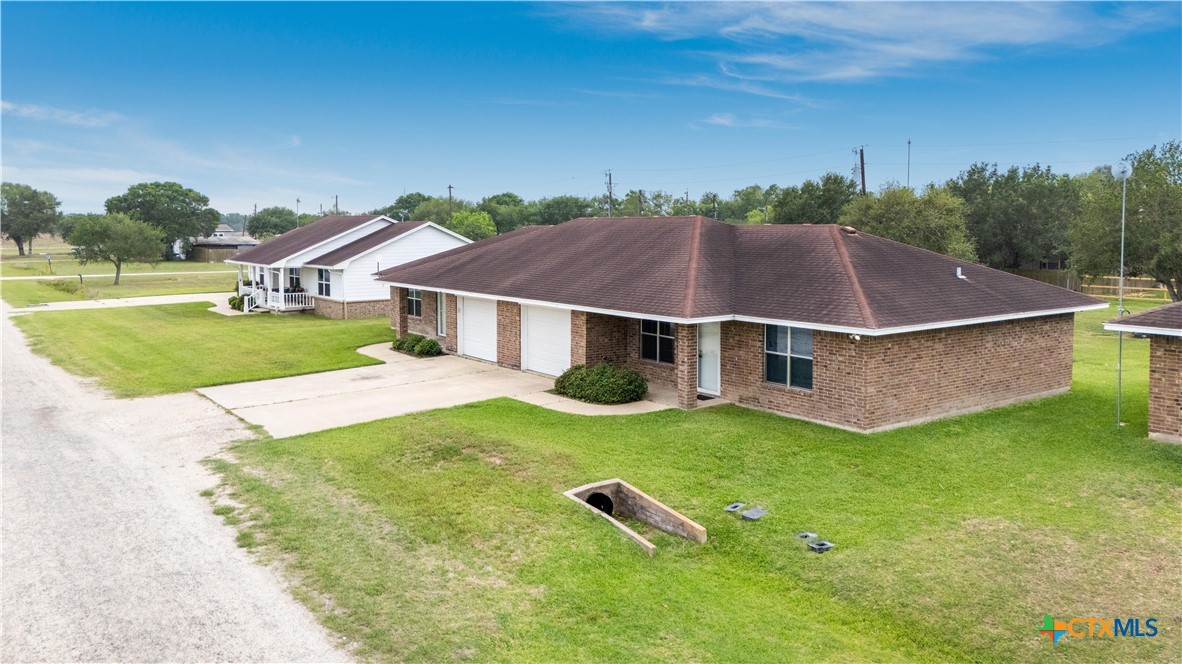 374-376 Navidad Street Vanderbilt, TX 77991 - Photo 3 of 28 an aerial view of residential houses with outdoor space and trees