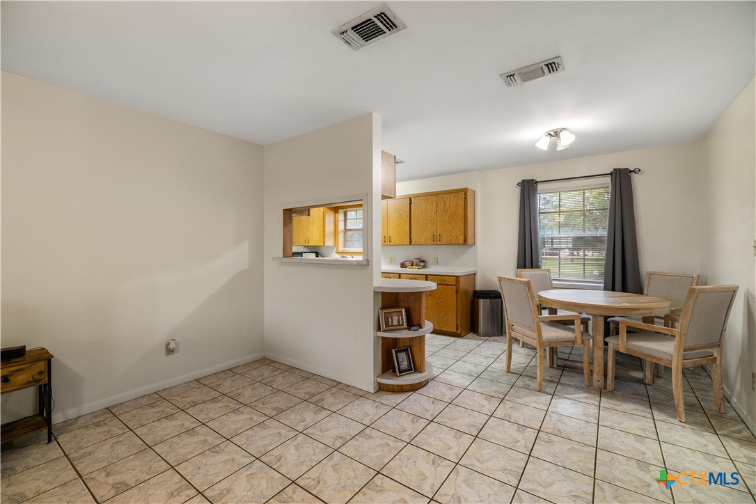 374-376 Navidad Street Vanderbilt, TX 77991 - Photo 6 of 28 a view of a workspace with furniture and window