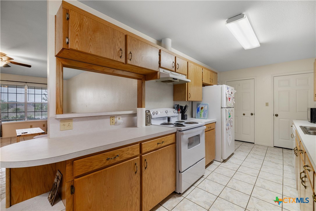 374-376 Navidad Street Vanderbilt, TX 77991 - Photo 8 of 28 a kitchen with stainless steel appliances a sink cabinets and a counter top space