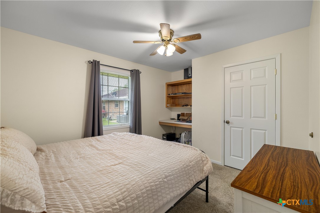 374-376 Navidad Street Vanderbilt, TX 77991 - Photo 9 of 28 a bedroom with a bed and a window