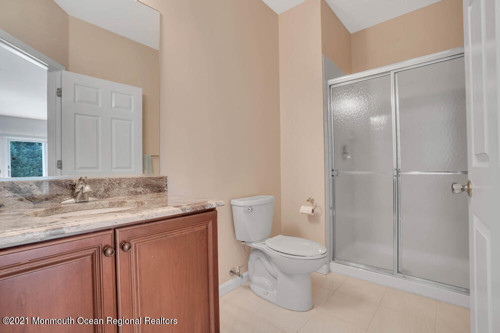 30 Red Oak Lane Freehold, NJ 07728 - Photo 16 of 73 a bathroom with a granite countertop sink toilet and shower