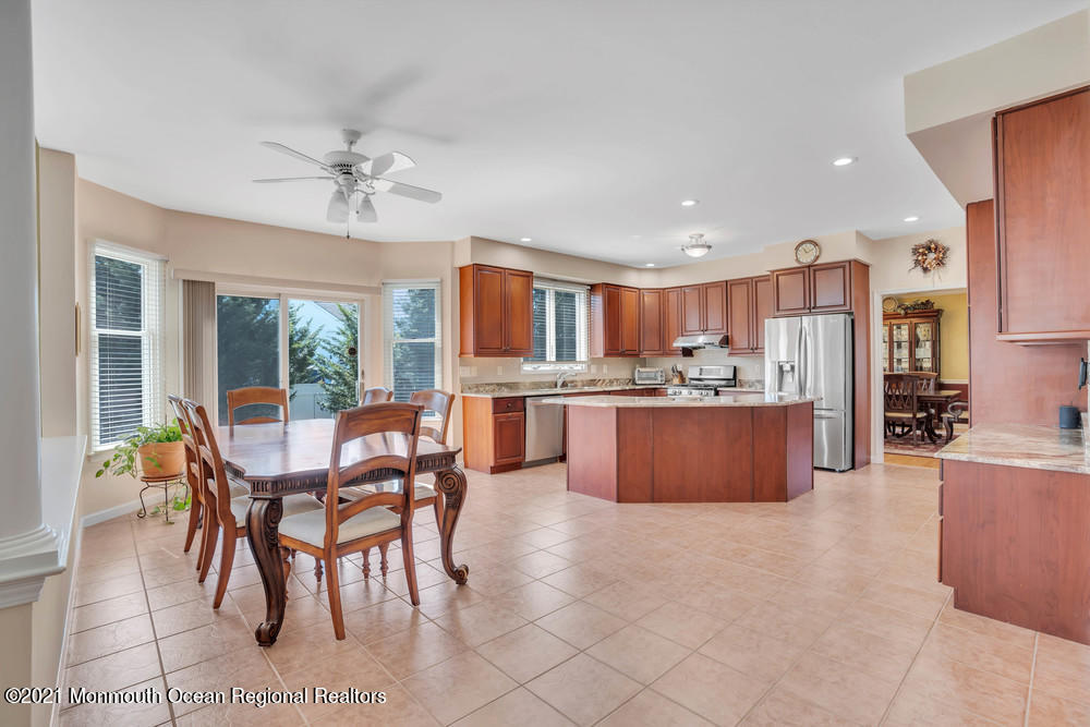 30 Red Oak Lane Freehold, NJ 07728 - Photo 28 of 73 a living room with stainless steel appliances kitchen island granite countertop furniture and a kitchen view