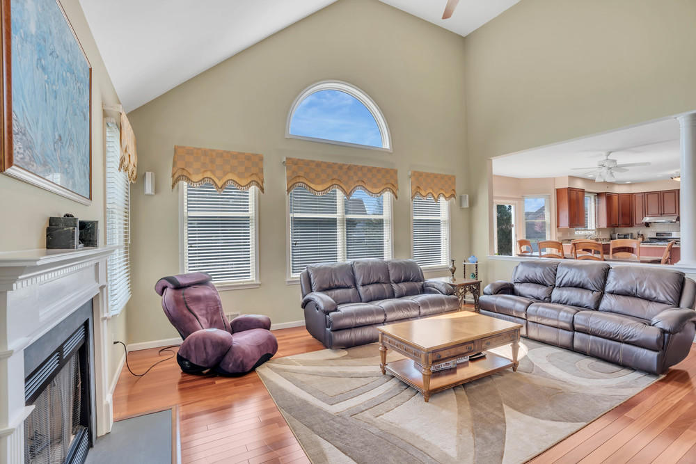 30 Red Oak Lane Freehold, NJ 07728 - Photo 31 of 73 a living room with furniture fireplace and a large window