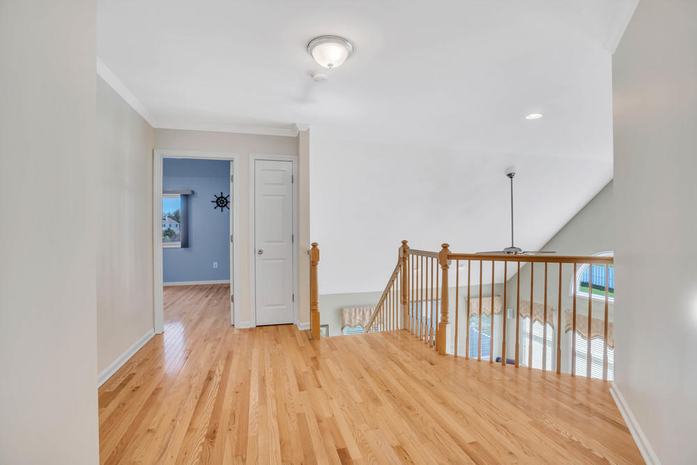 30 Red Oak Lane Freehold, NJ 07728 - Photo 34 of 73 a view of hallway with wooden floor