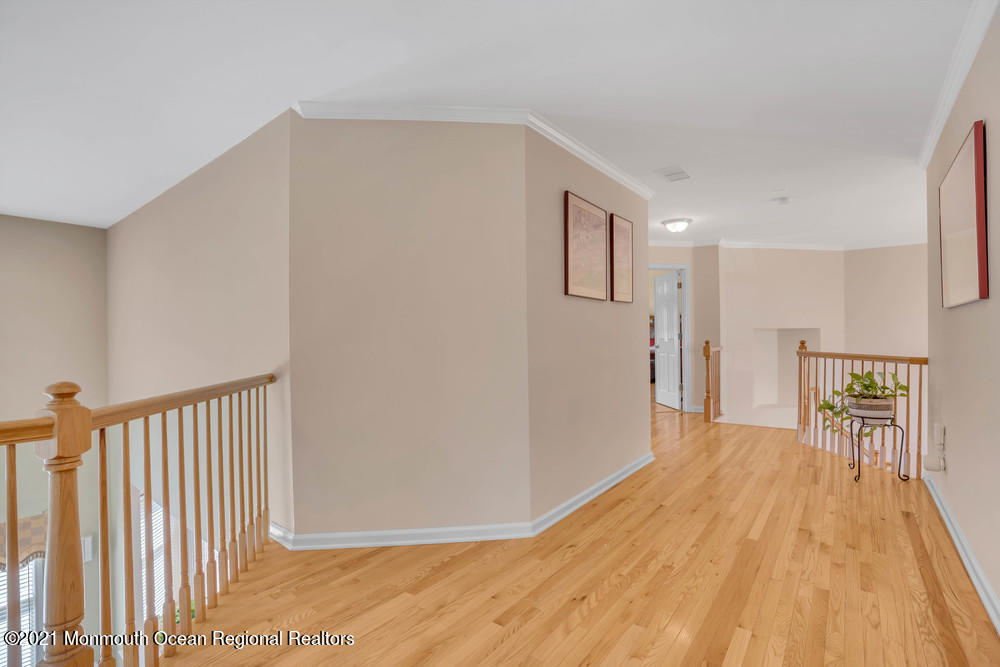 30 Red Oak Lane Freehold, NJ 07728 - Photo 42 of 73 a view of empty room with wooden floor