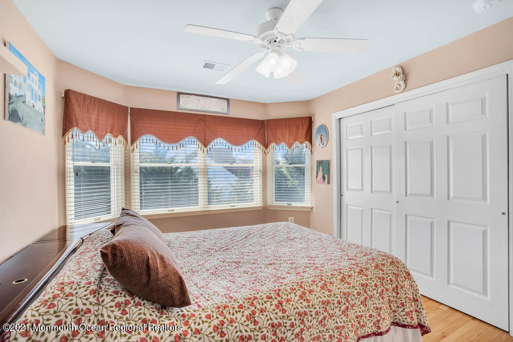 30 Red Oak Lane Freehold, NJ 07728 - Photo 44 of 73 a bedroom with a bed and a large window