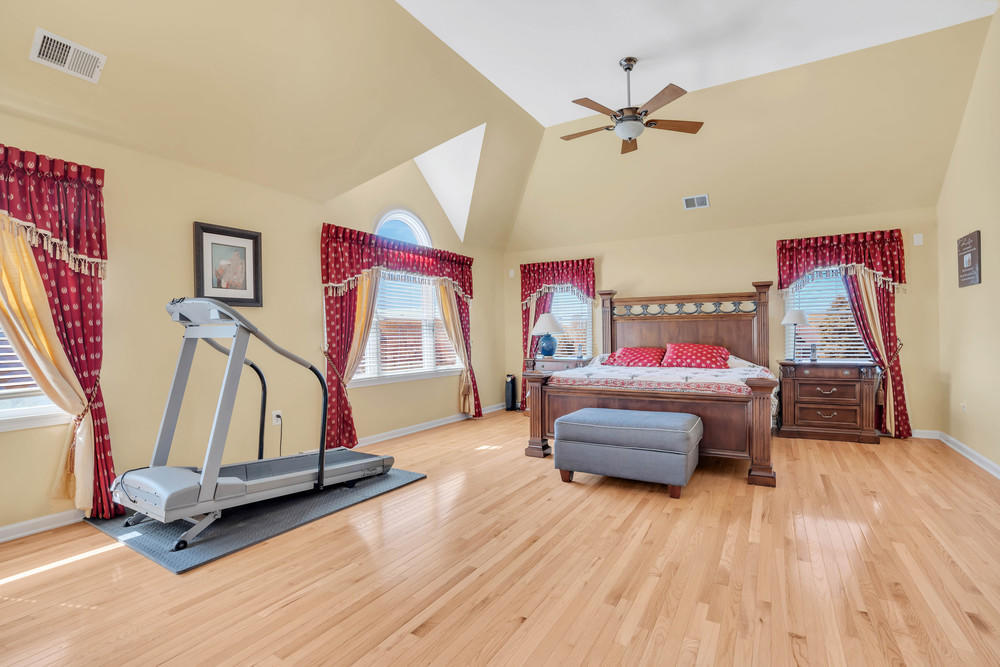 30 Red Oak Lane Freehold, NJ 07728 - Photo 48 of 73 a bedroom with bed and gym equipment
