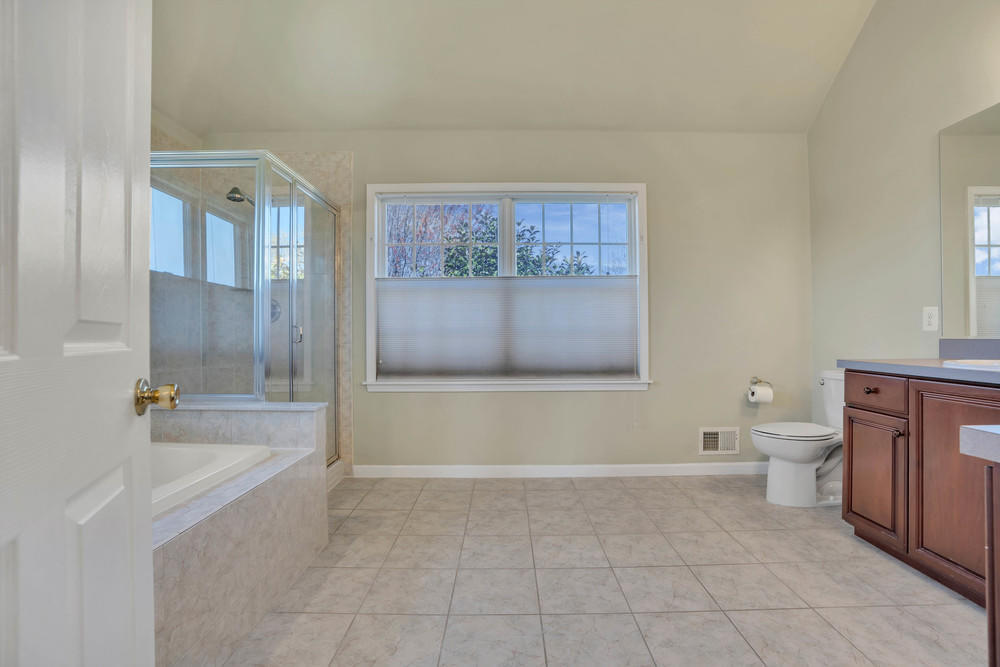 30 Red Oak Lane Freehold, NJ 07728 - Photo 50 of 73 a bathroom with a bathtub and a toilet