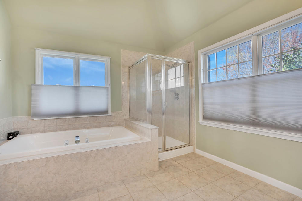 30 Red Oak Lane Freehold, NJ 07728 - Photo 53 of 73 a bathroom with a bathtub and a shower