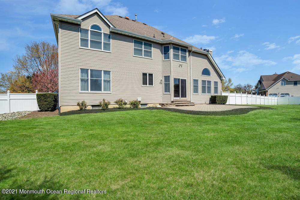 30 Red Oak Lane Freehold, NJ 07728 - Photo 62 of 73 a front view of a house with a yard and garage
