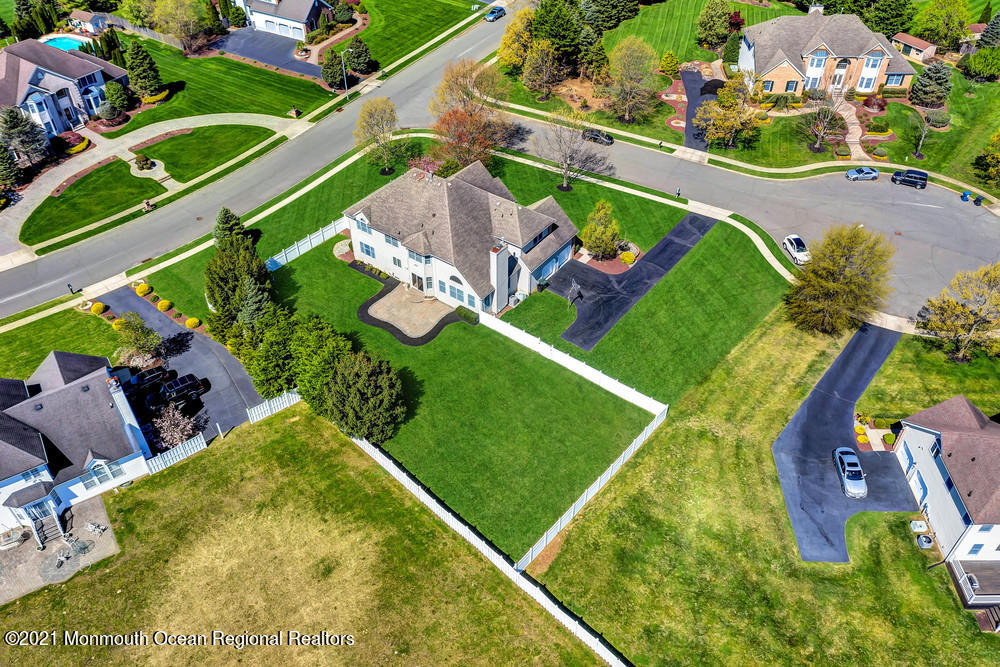 30 Red Oak Lane Freehold, NJ 07728 - Photo 69 of 73 an aerial view of a pool a garden patio and mountain view in back