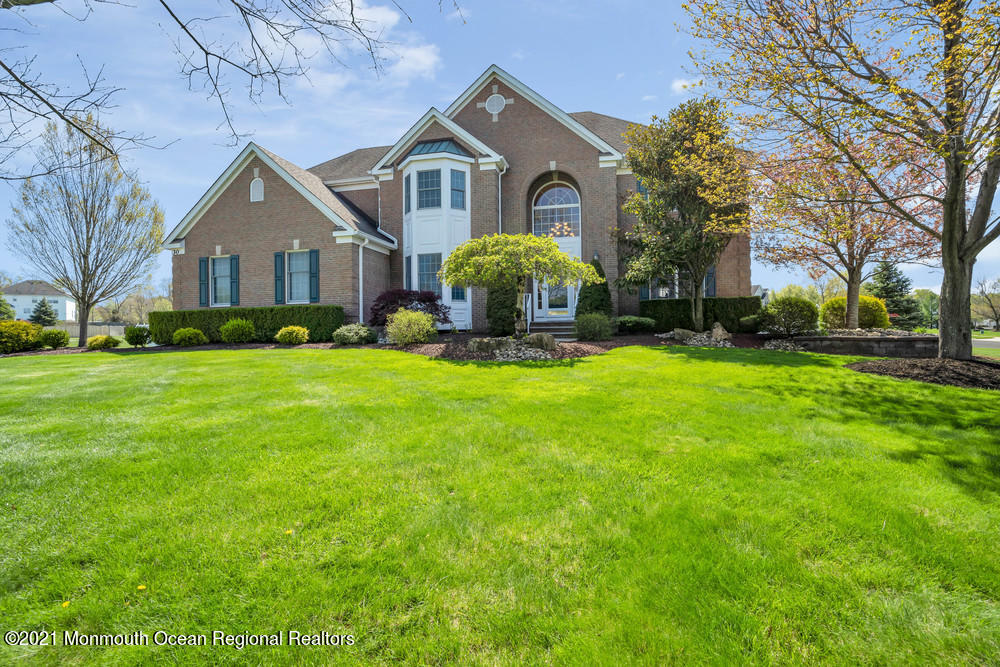 30 Red Oak Lane Freehold, NJ 07728 - Photo 73 of 73 a front view of house with yard and green space
