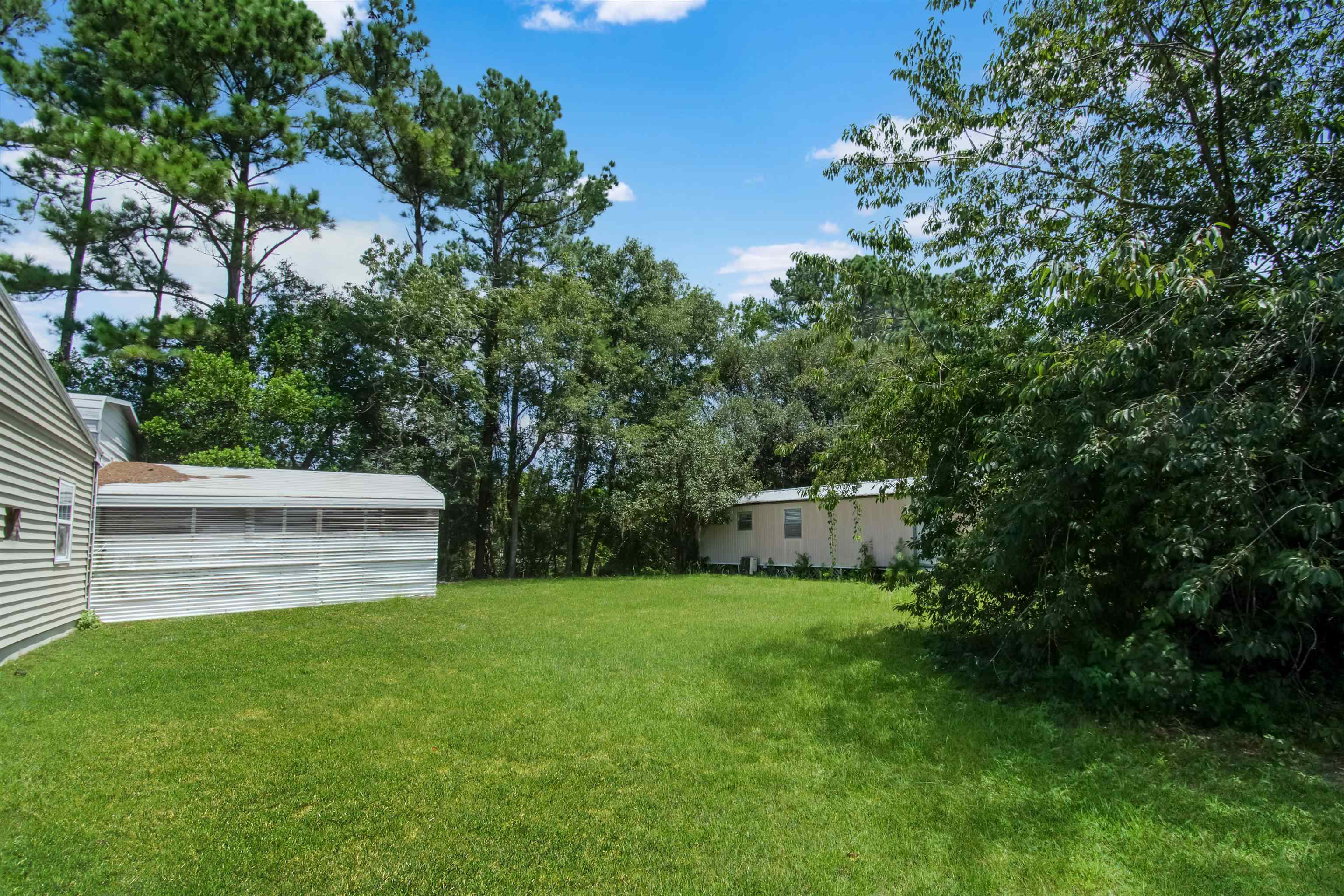 463493 State Road 200 Yulee, FL 32097 - Photo 19 of 20 a view of a house with a yard