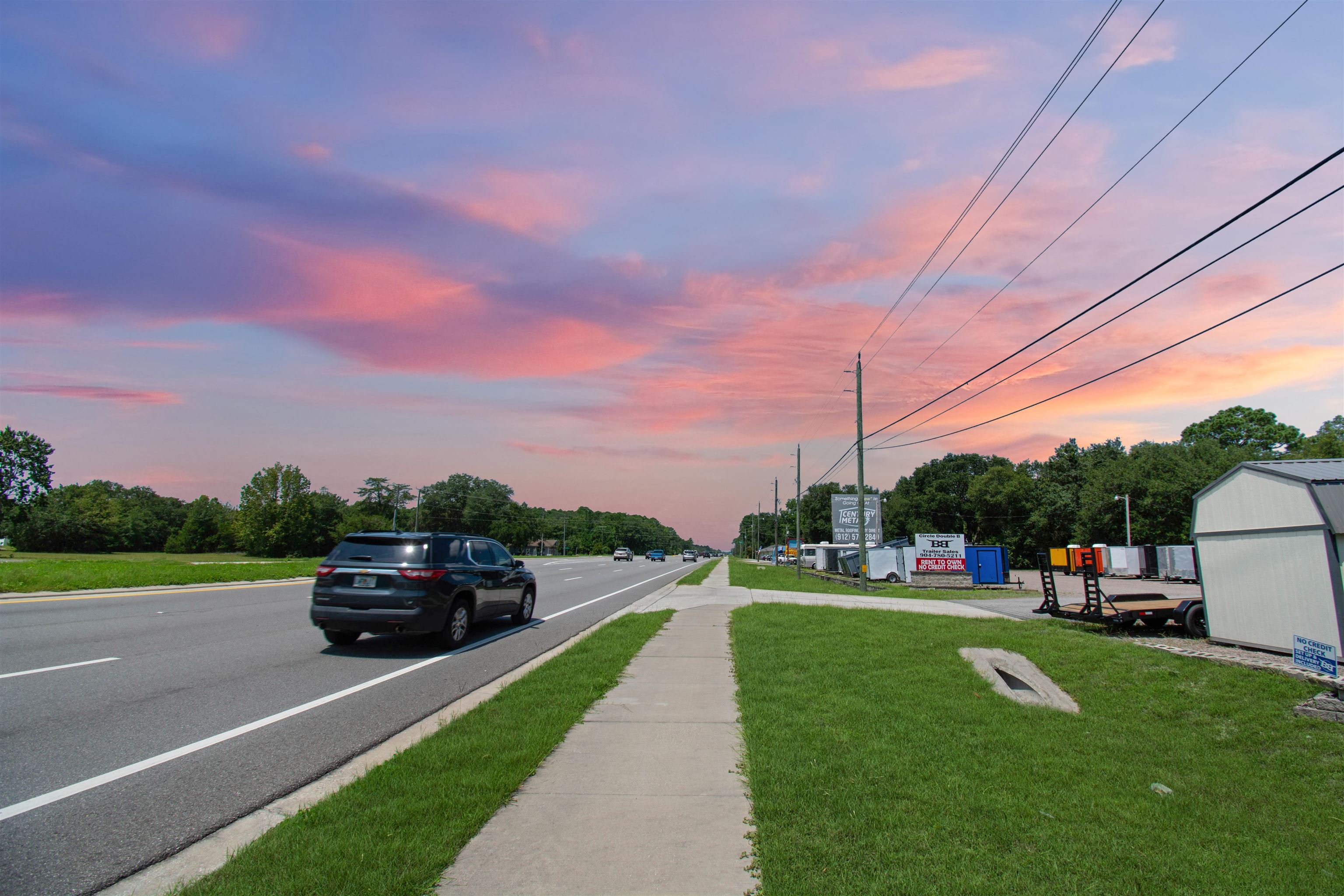 463493 State Road 200 Yulee, FL 32097 - Photo 2 of 20 a car parked on the side of the road