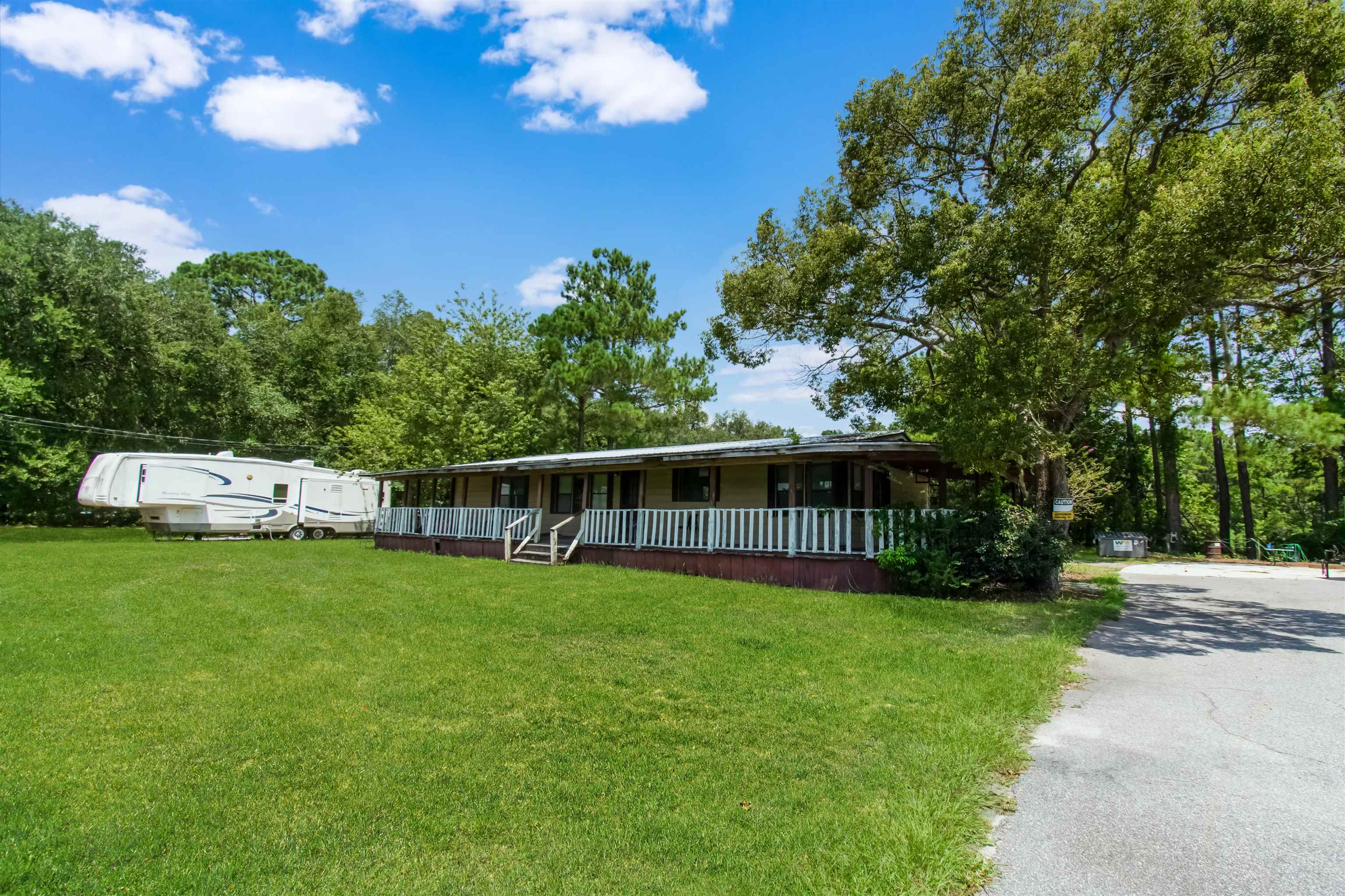 463493 State Road 200 Yulee, FL 32097 - Photo 8 of 20 a view of a house with backyard and sitting area