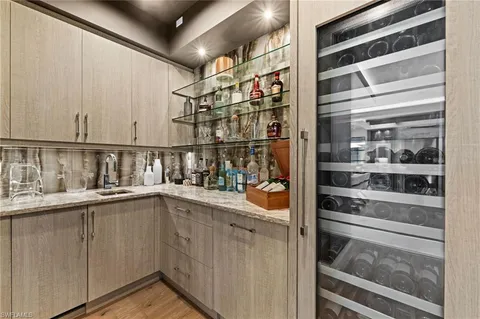 a kitchen with a sink and cabinets