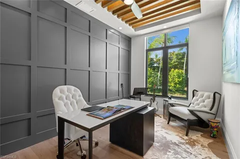 a reading room with furniture and a window