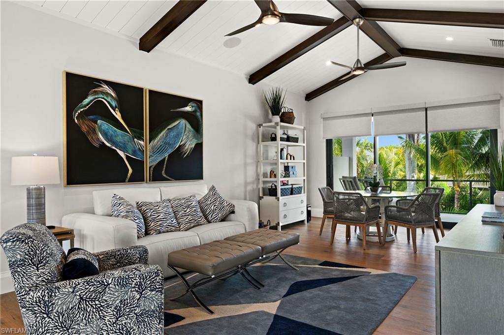 255 21st Avenue South Naples, FL 34102 - Photo 24 of 36 a living room with furniture and a large window