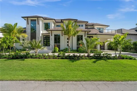 a front view of building with yard