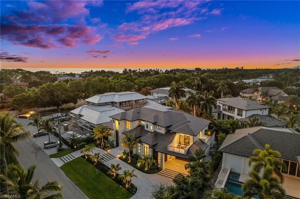 255 21st Avenue South Naples, FL 34102 - Photo 35 of 36 an aerial view of a city with lots of residential buildings ocean and mountain view in back