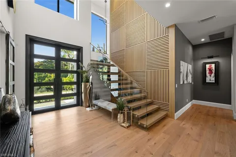 a view of entryway with stairs and wooden floor
