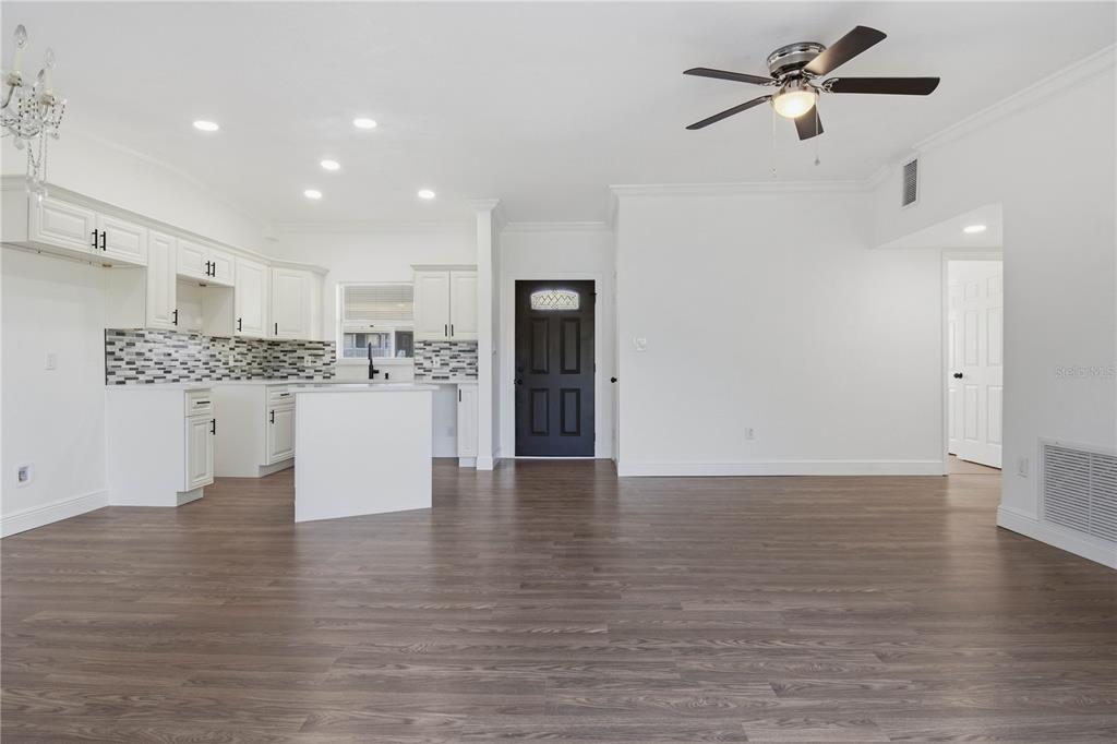 5601 Meridian Way Orlando, FL 32808 - Photo 16 of 34 a view of kitchen with refrigerator and window