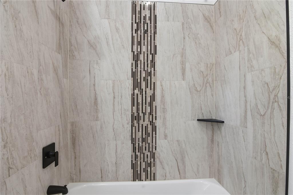 5601 Meridian Way Orlando, FL 32808 - Photo 20 of 34 a view of a bathroom with a shower