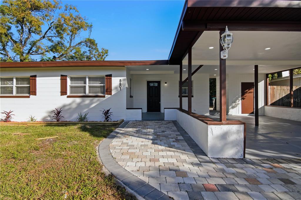 5601 Meridian Way Orlando, FL 32808 - Photo 2 of 34 a view of swimming pool with seating space