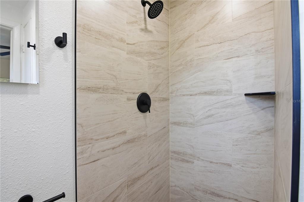 5601 Meridian Way Orlando, FL 32808 - Photo 25 of 34 a bathroom with a shower