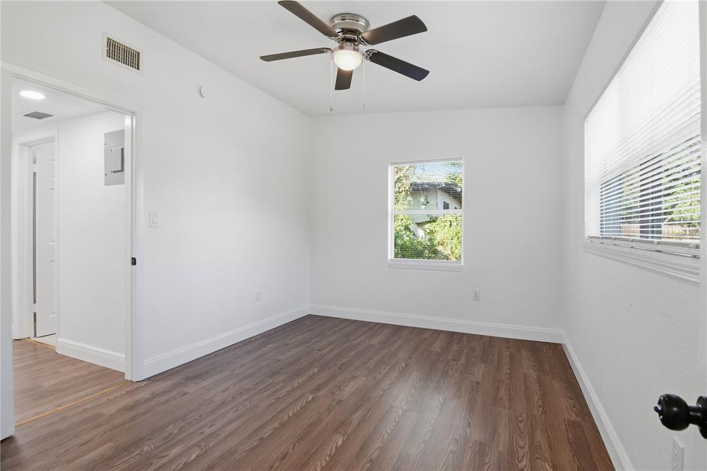5601 Meridian Way Orlando, FL 32808 - Photo 26 of 34 wooden floor in an empty room with a window