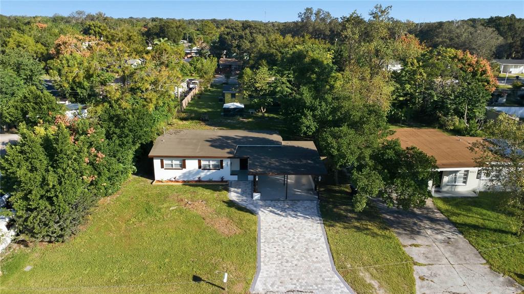 5601 Meridian Way Orlando, FL 32808 - Photo 32 of 34 an aerial view of a house with swimming pool and garden view